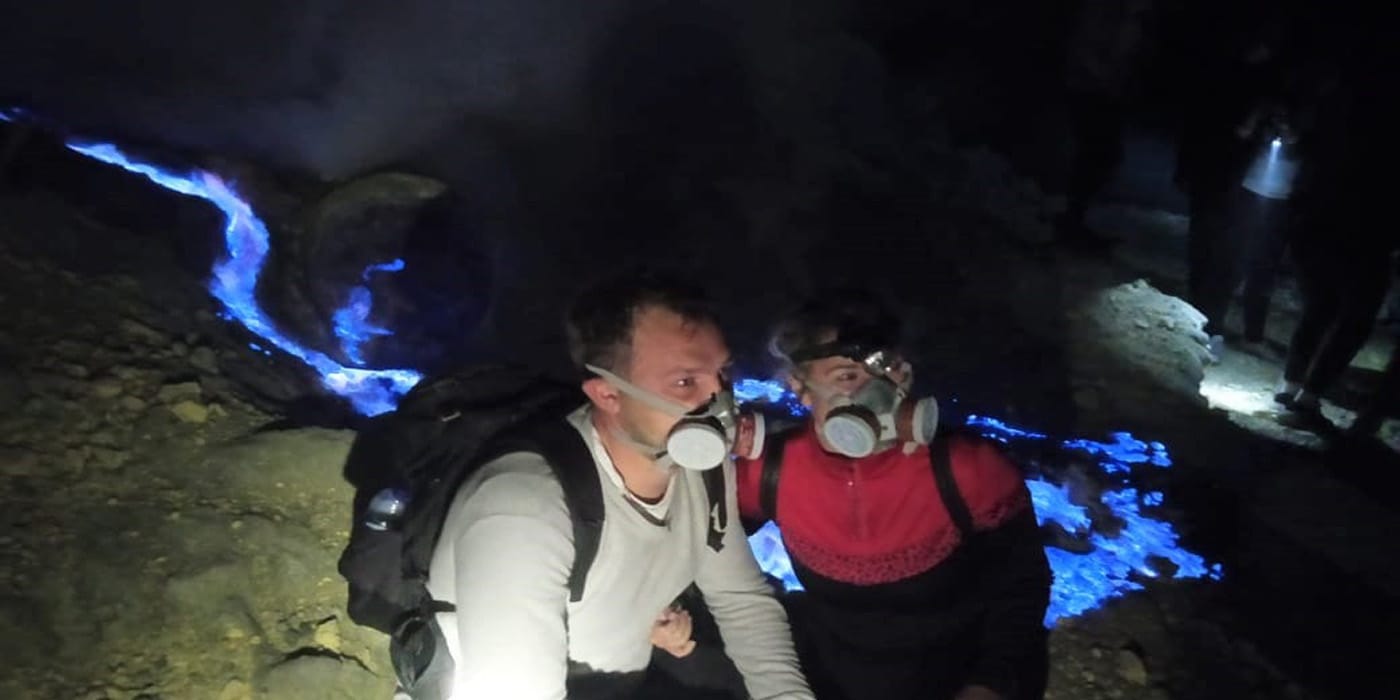 Tourist are enjoying the beautiful blue flame from Ijen crater