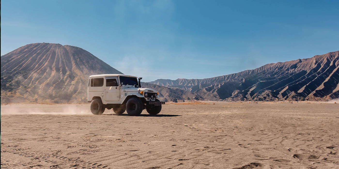 4x4 jeep adventure through Mount Bromo volcanic landscape East Java
